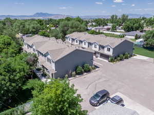 Aerial perspective of suburban area with a mountainous background