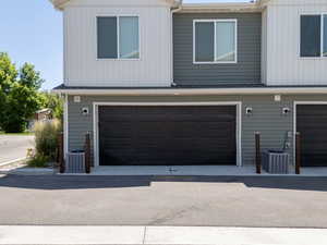 View of garage doors at rear of fiveplex's