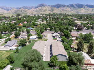 Aerial perspective of suburban area featuring a mountainous background