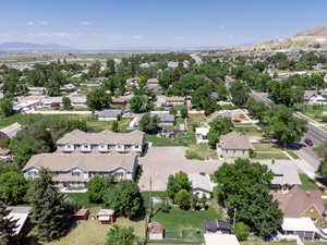 Aerial perspective of suburban area with a mountainous background