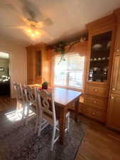 Dining room featuring wood finished floors and a ceiling fan