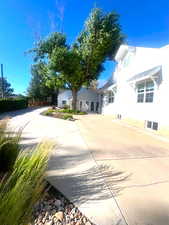View of side of home with driveway