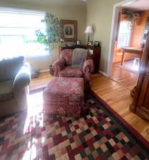 Living room with plenty of natural light and light wood finished floors