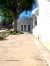 Back of house with french doors and a patio