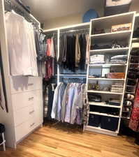 Spacious closet featuring wood finished floors