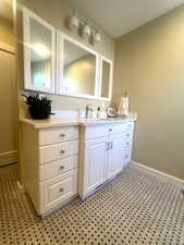 Bathroom featuring baseboards and vanity