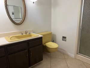 Bathroom featuring vanity and tile patterned flooring