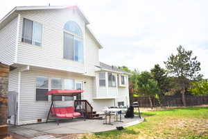 Back of property with a patio