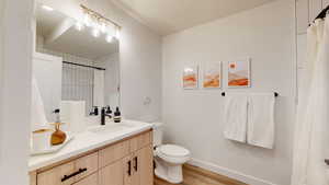 Bathroom featuring vanity and wood finished floors