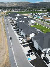 Aerial view of residential area featuring a mountainous background