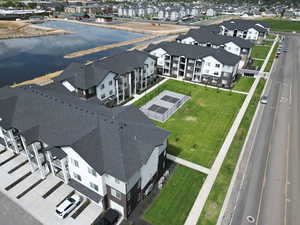 Aerial perspective of suburban area with a nearby body of water