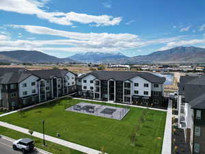 Aerial perspective of suburban area featuring a mountainous background