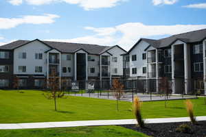 View of home's community with a lawn and a residential view