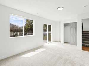 5th Bedroom, large office or entertainment area with walk out onto new wood deck