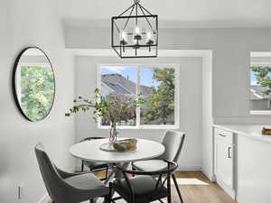 Dining space featuring a chandelier and light wood-style flooring