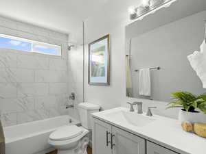 Full bathroom with vanity and bathtub / shower combination, new tile & fixtures.