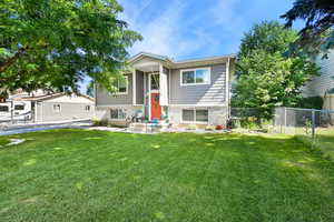 Raised ranch featuring brick siding