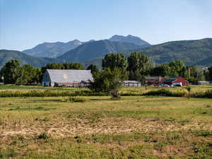View of mountain backdrop with rural landscape