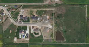 Aerial overview of property's location featuring property parcel outlined