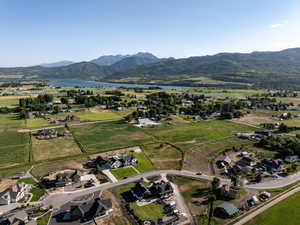 Aerial view of property's location featuring a water and mountain view