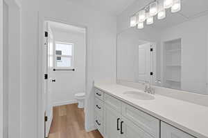 Bathroom with vanity and light wood finished floors