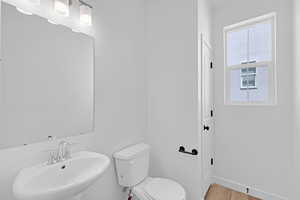 Bathroom with a sink and light wood finished floors