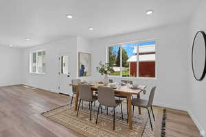 Dining area featuring recessed lighting and light wood finished floors