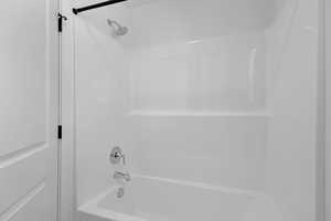 Bathroom with shower / tub combination