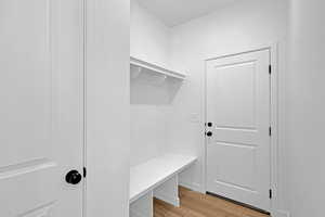 Mudroom with light wood-type flooring