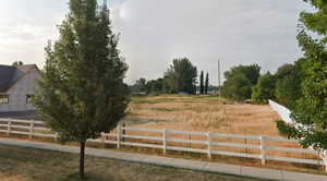 View of yard with a view of countryside