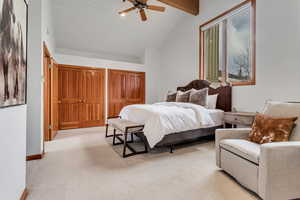 Bedroom with light colored carpet, a ceiling fan, and wood ceiling