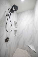 Bathroom with tiled shower