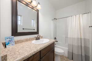 Bathroom with vanity and shower / bath combo