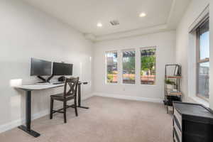 Office area featuring light colored carpet and recessed lighting