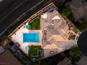 Aerial view of property and surrounding area with a pool