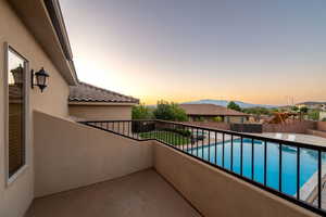 Balcony with a mountain view and view of pool