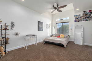 Bedroom featuring a high ceiling, carpet flooring, a ceiling fan, and recessed lighting