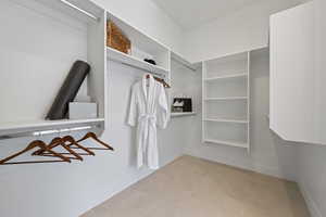 Spacious closet with light tile patterned flooring