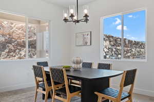 Dining space featuring a chandelier and wood finished floors