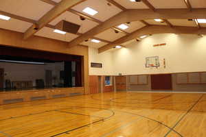 Sport court with raised performance stage