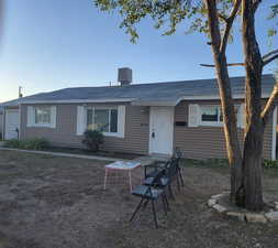 View of front of house featuring a shingled roof