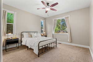 Bedroom with carpet floors and a ceiling fan