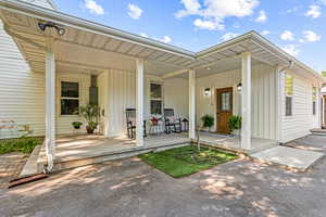 Entrance to property with covered porch