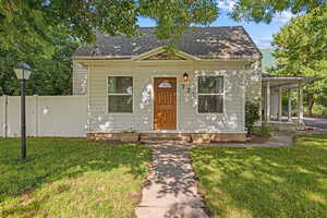 View of front of house with roof with shingles