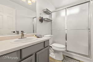 Bathroom featuring vanity and a stall shower