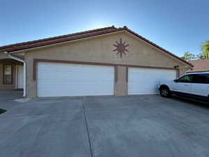 Garage with concrete driveway