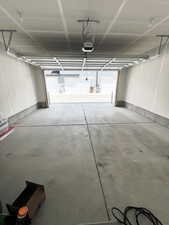 Garage featuring a garage door opener