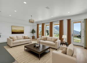 Living area with a mountain view and recessed lighting