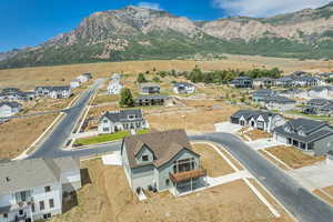 Aerial perspective of suburban area with a mountainous background
