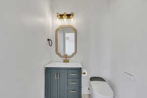Bathroom with vanity and toilet